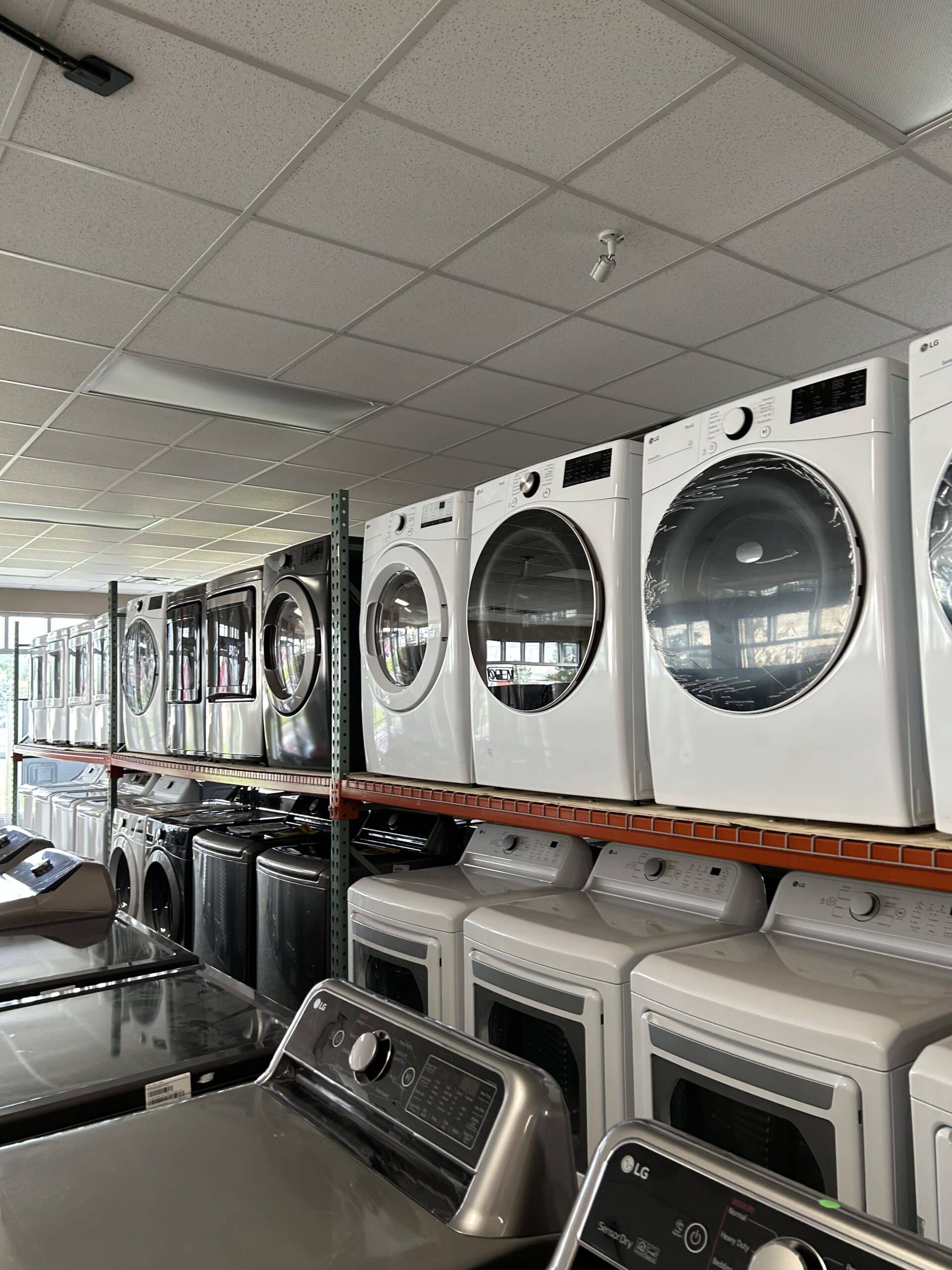 Top and bottom shelves of washers and dryers